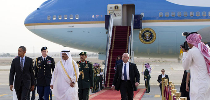 US President Barack Obama (L) is welcomed by Prince Khaled Bin Bandar Bin Abdul Aziz, Emir of Riyadh (3rdL), upon his arrival at King Khalid International Airport in Riyadh, Saudi Arabia, on March 28, 2014. Obama arrived in Riyadh for talks with Saudi King Abdullah as mistrust fuelled by differences over Iran and Syria overshadows a decades-long alliance between their countries. AFP PHOTO / SAUL LOEB (Photo credit should read SAUL LOEB/AFP/Getty Images)
